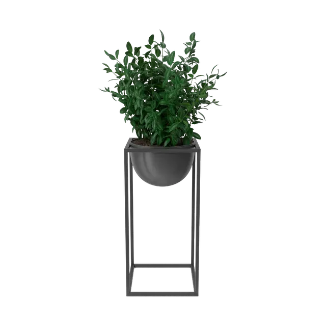 Artificial boxwood plant in a black bowl on a tall metal stand, front view