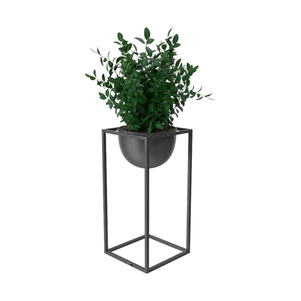 Artificial boxwood plant in a black bowl on a tall metal stand, angled view