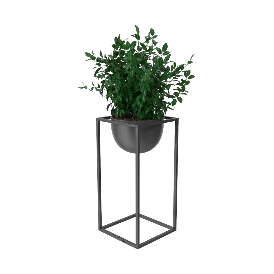 Artificial boxwood plant in a black bowl on a tall metal stand, side view